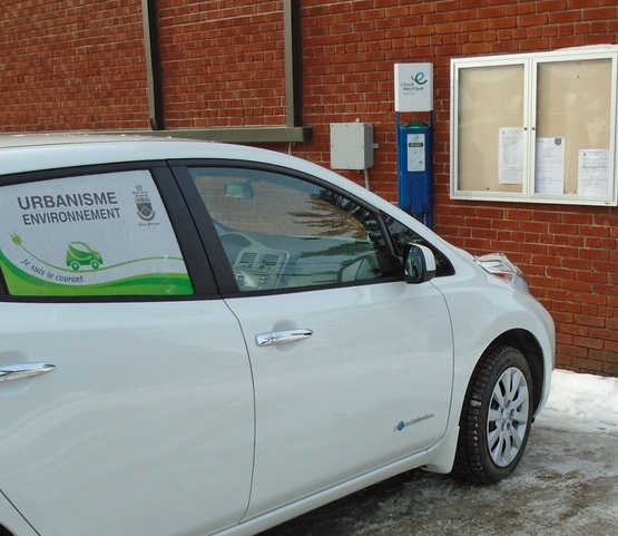 A car recharging at a charging station in St- André d&#39;Argenteuil