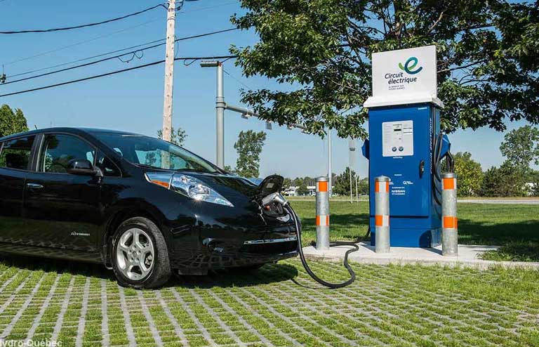 Electric vehicle plugged in to a 400-volt fast-charge station